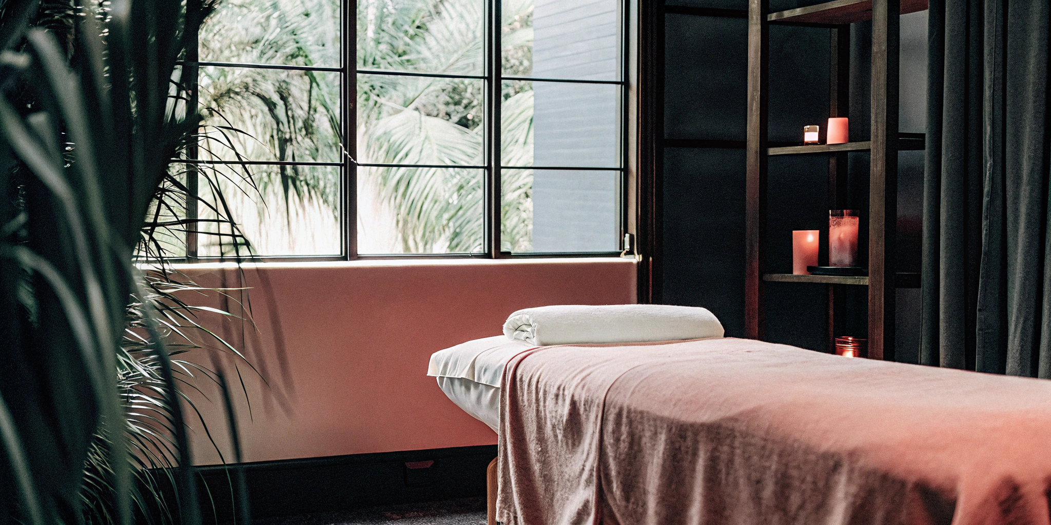 Massage table in a tranquil room, prepared for a session focusing on myofascial massage benefits.
