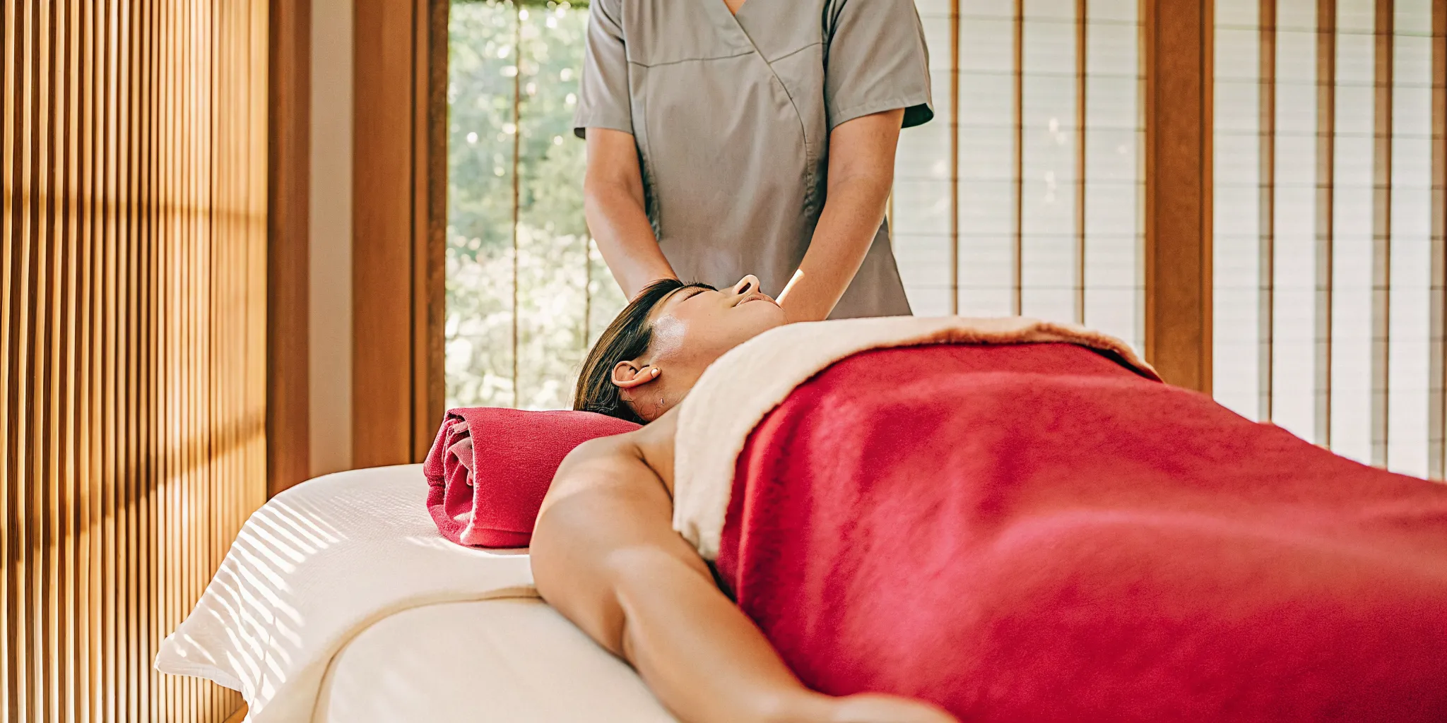 A client receiving a professional back massage at a local spa.