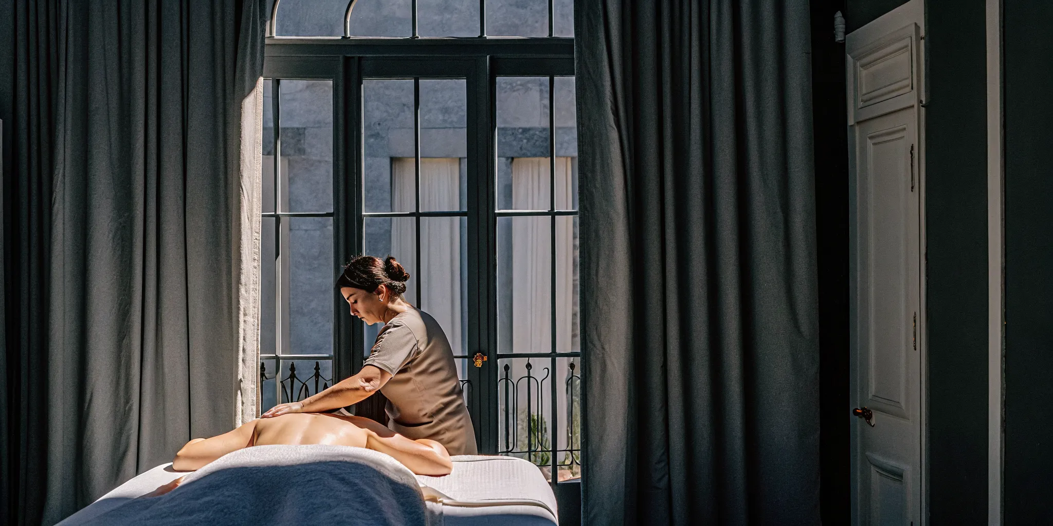 A New Orleans massage therapist targets back pain with a therapeutic massage.