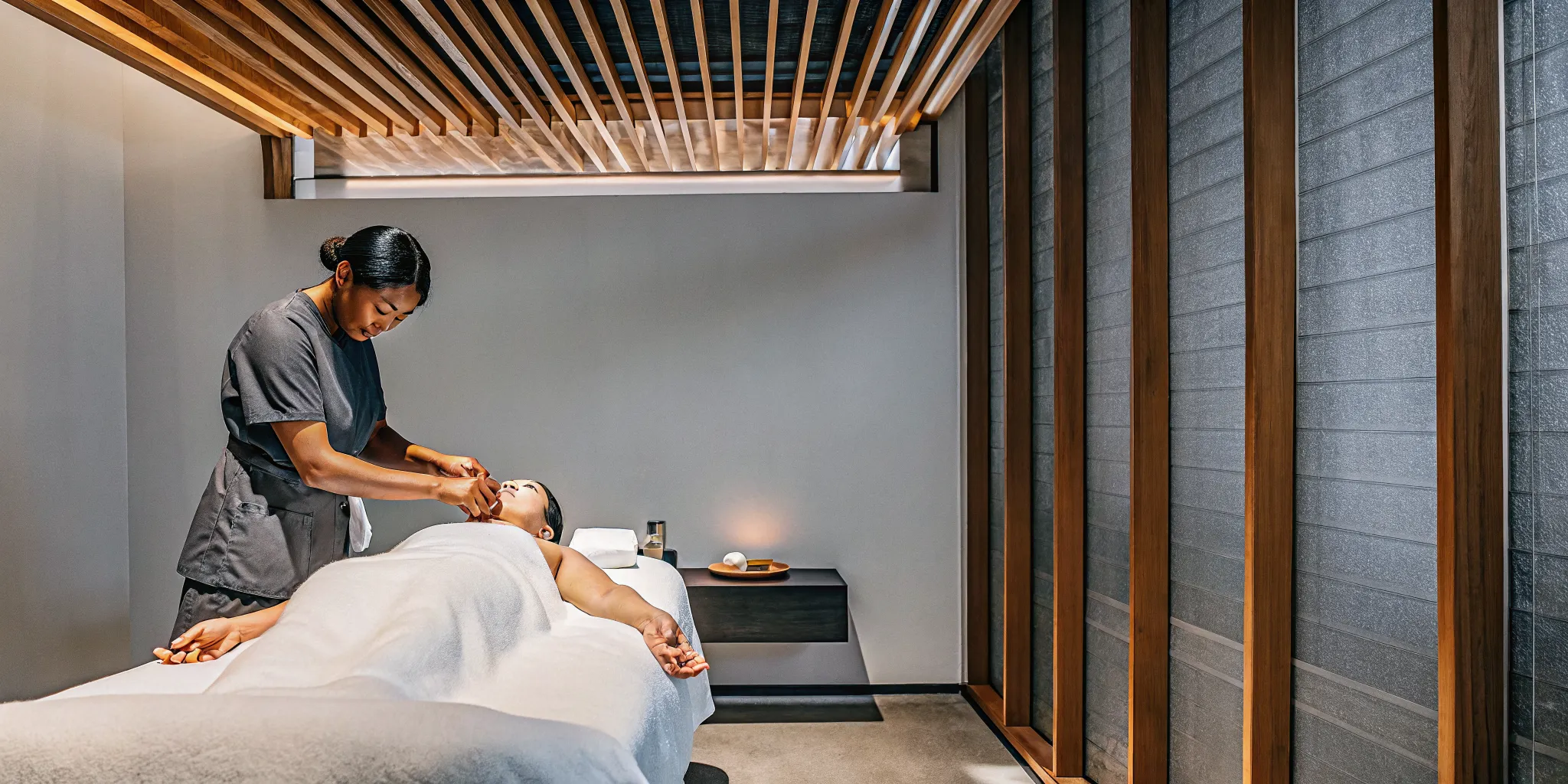 Full body Ashiatsu massage with a therapist using their feet to apply deep pressure.