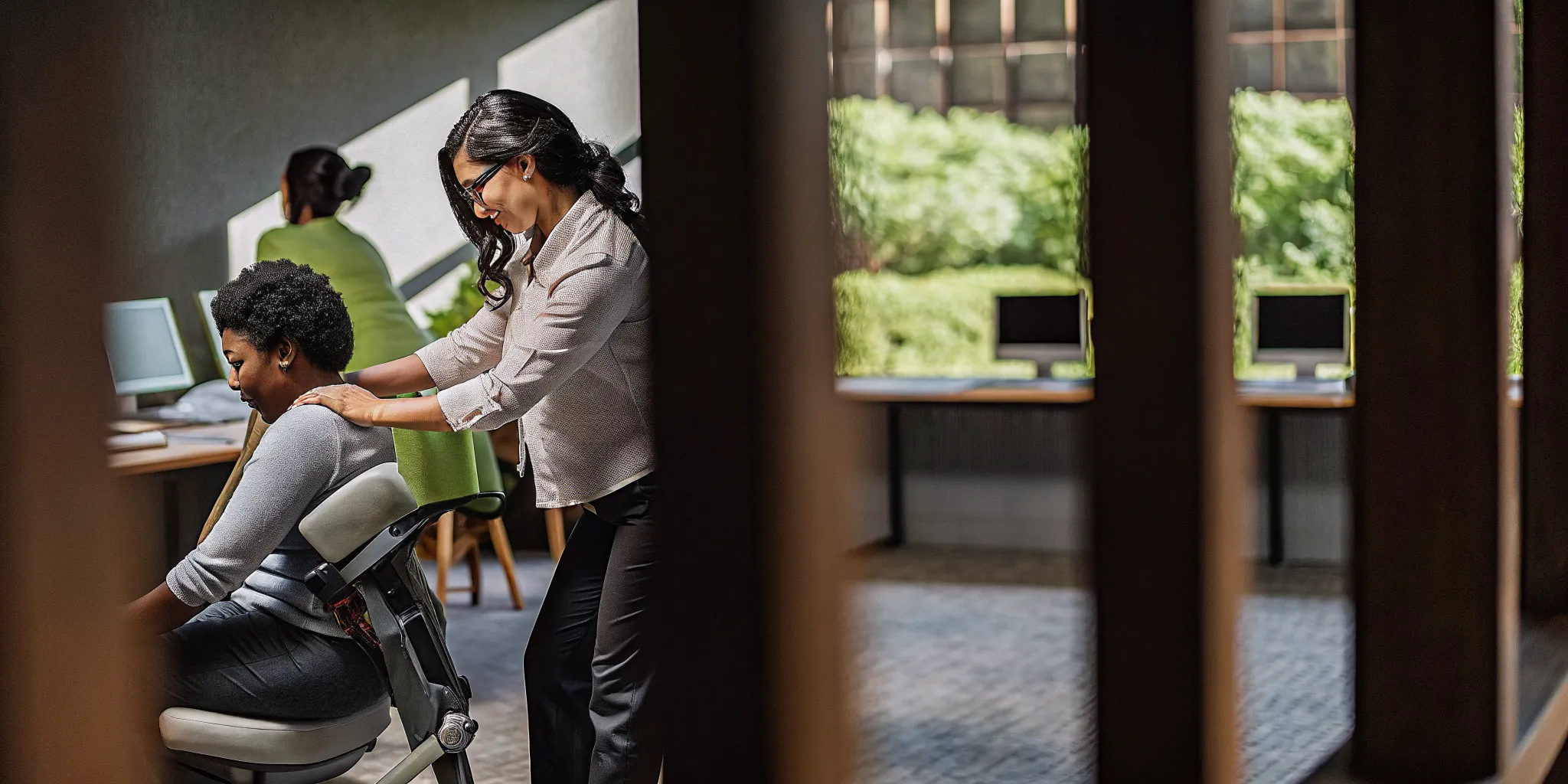 Professional massage therapist providing chair massage at a corporate event in a modern New Orleans office