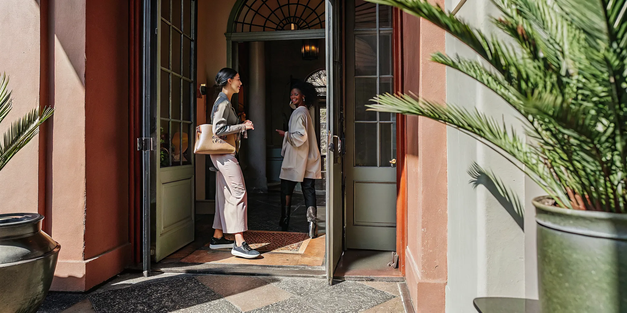 Elegant massage studio entrance in downtown New Orleans historic building with warm atmosphere
