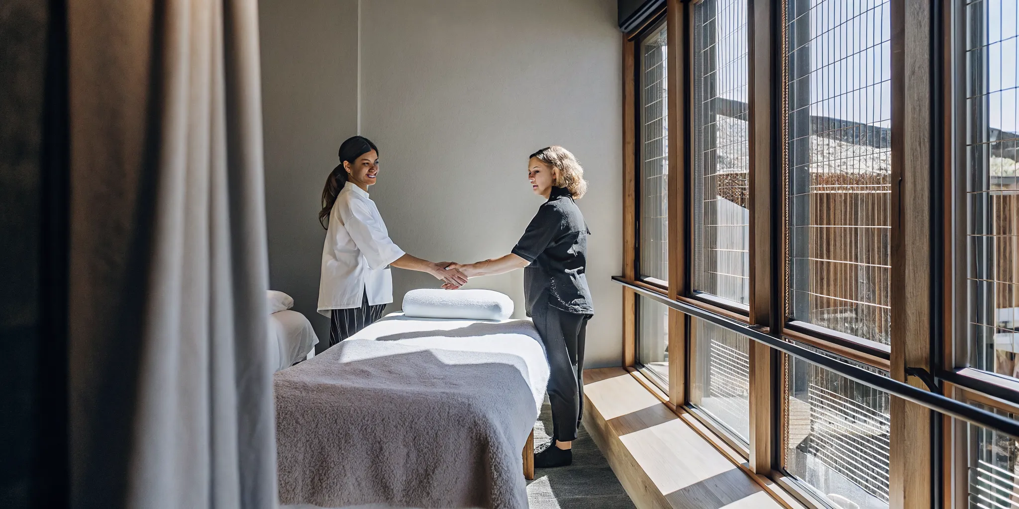 Warm and welcoming massage studio reception area in downtown New Orleans with natural light and calming earth tones